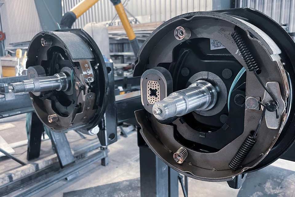 trailer axles on a rack